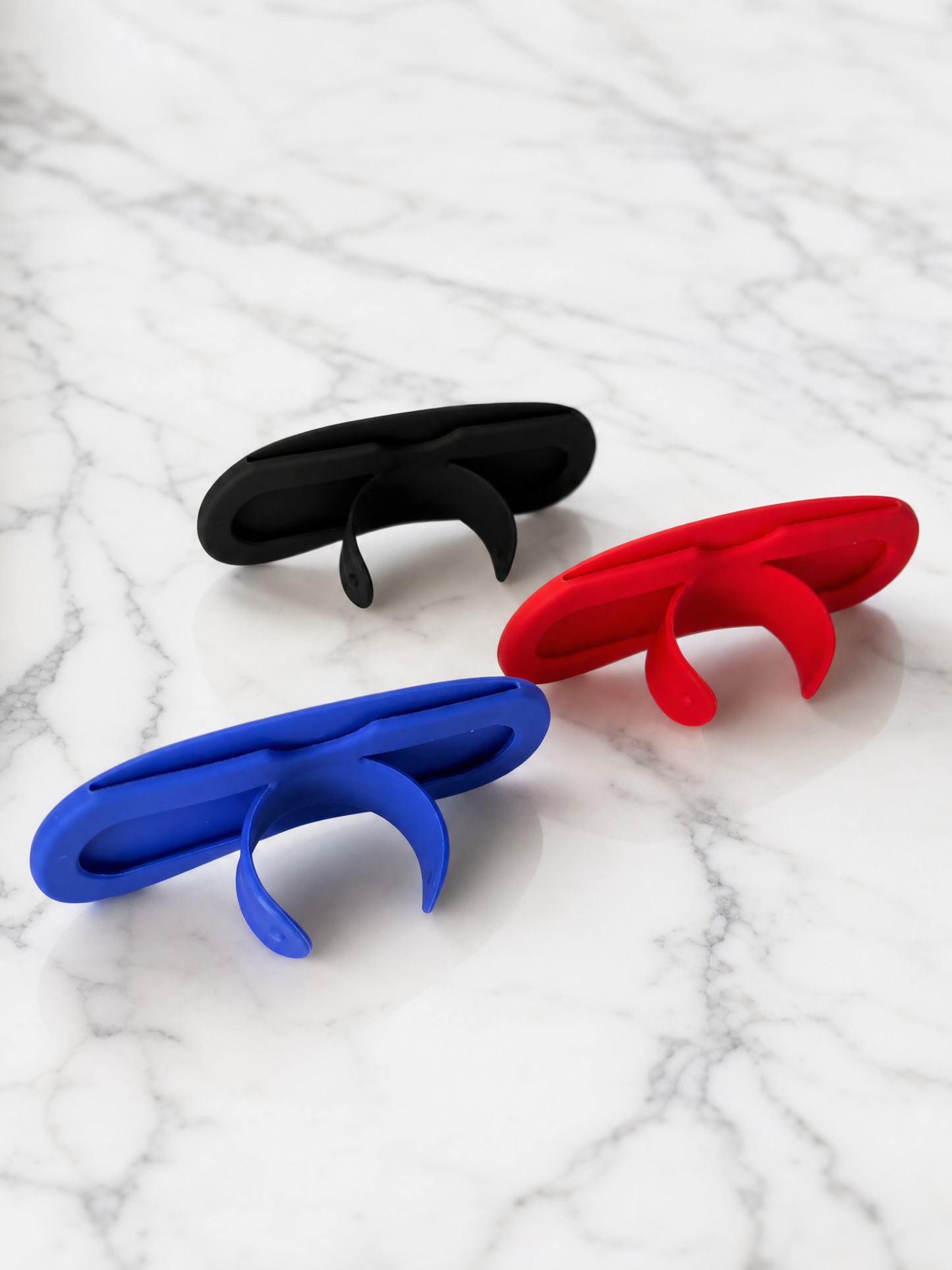 Silicone Nose Reader Sleeves with Pop-Up Stand - Black Blue Red on Marble